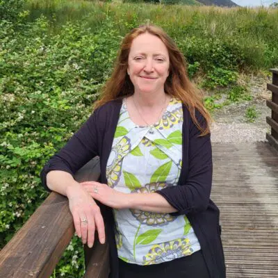 Photo of a woman on a bridge