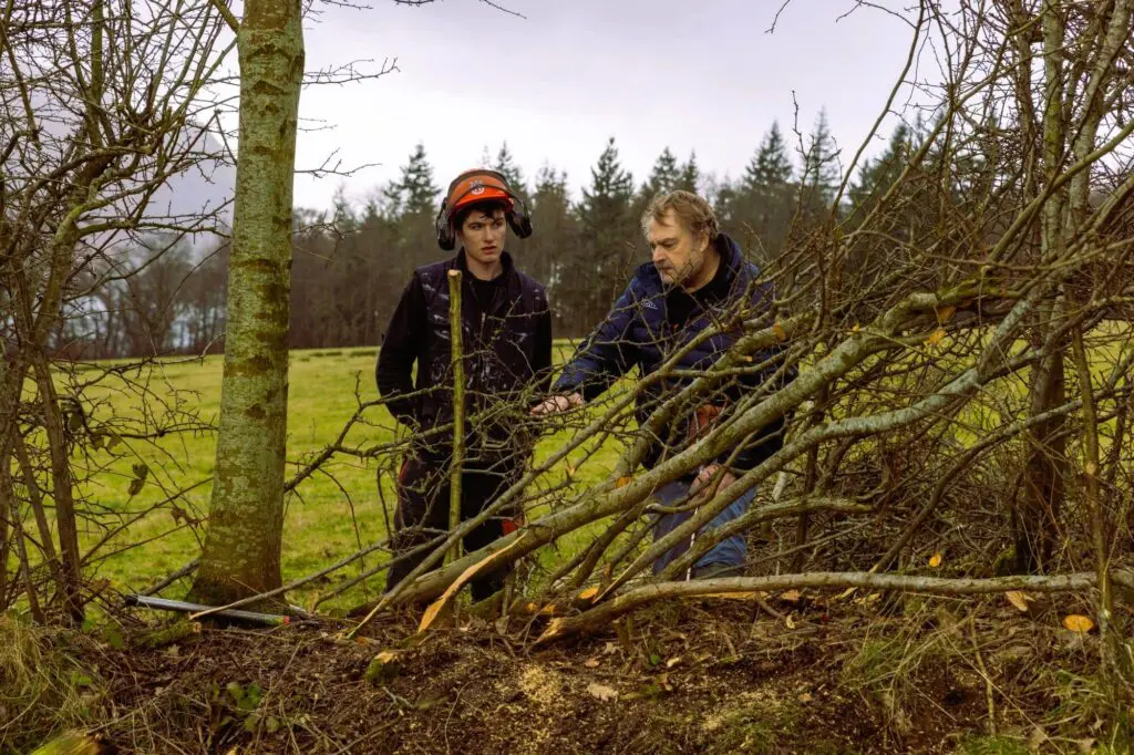 Overall winner John Handley with judge Mossop Jobson looking at a hedge