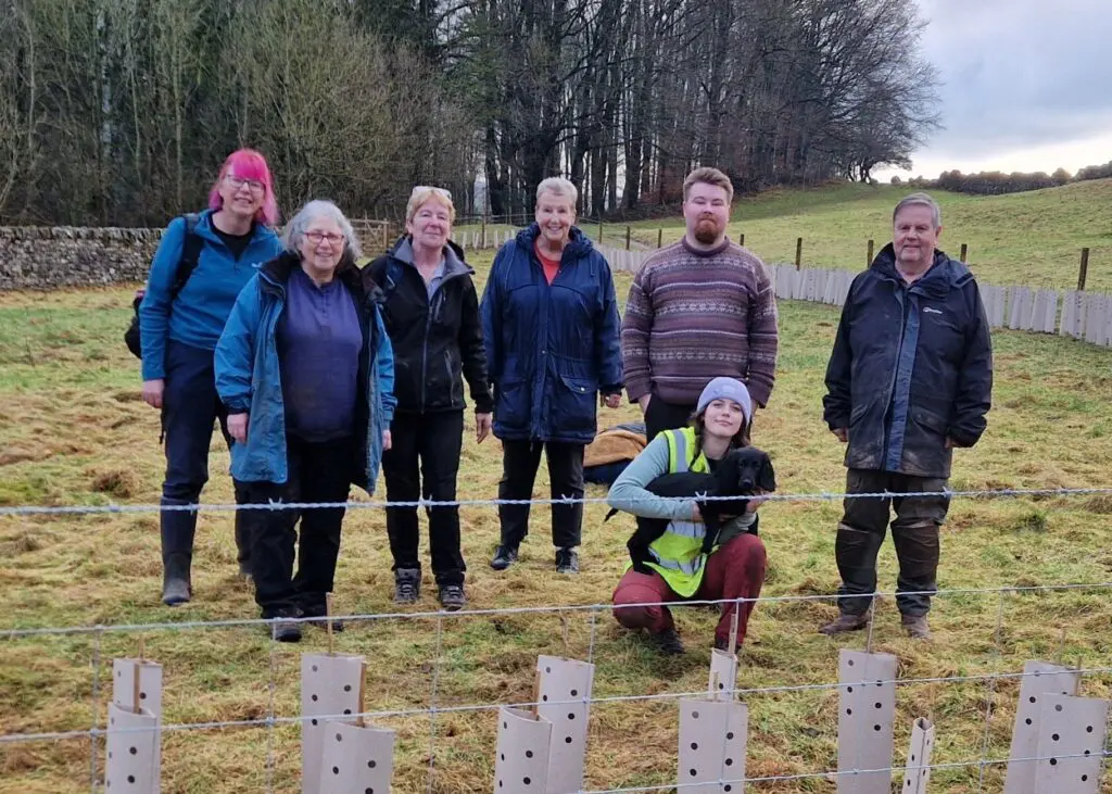 Naomi and Hedges and Edges volunteers with hedge they planted at St.Peters Church