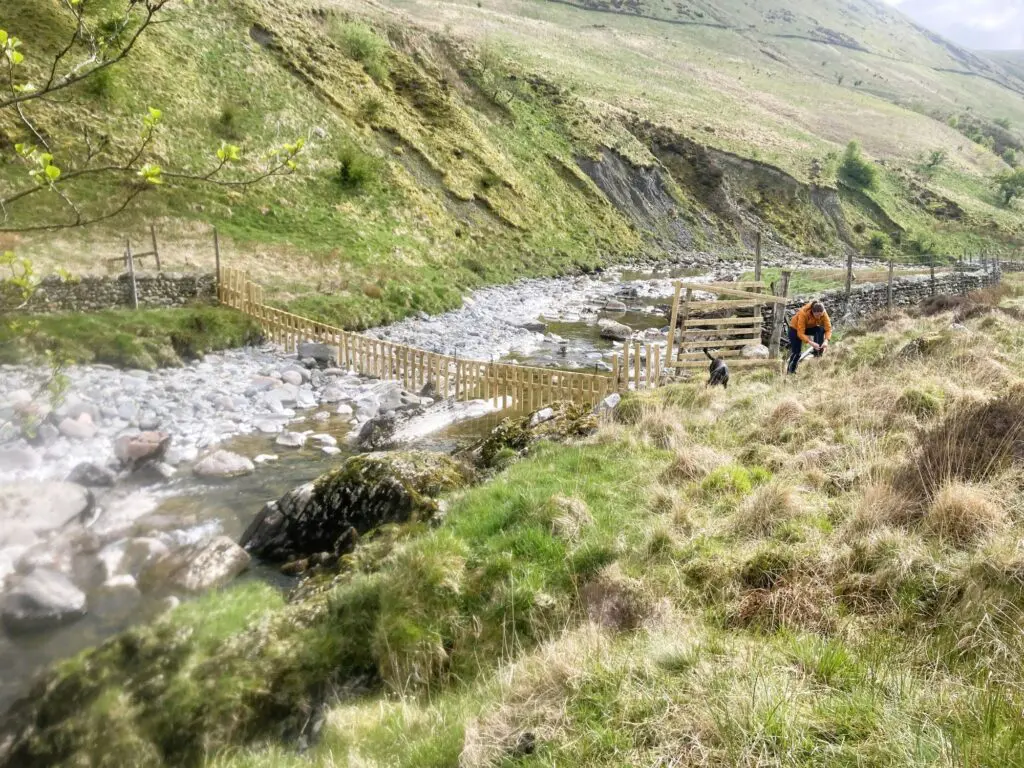High Borrowdale valley with a river and a watergate