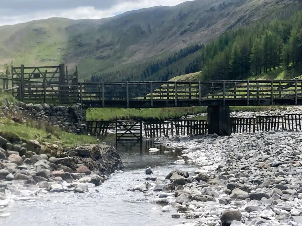 High Borrowdale valley with a river and a watergate