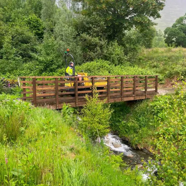 Dumper going over bridge taking stone for Rachel's seat