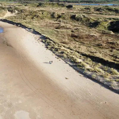 A view from above of sand dunes and coastline at Roanhead