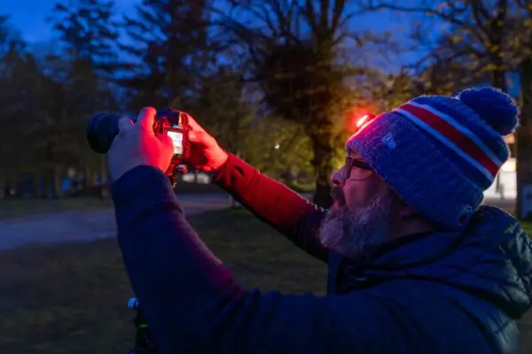A man holding up a camera