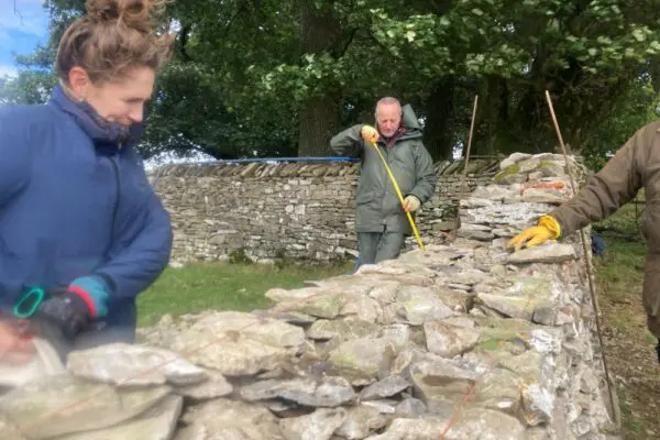 Volunteers working on dry stone wall