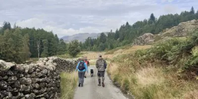 people walking down a country road