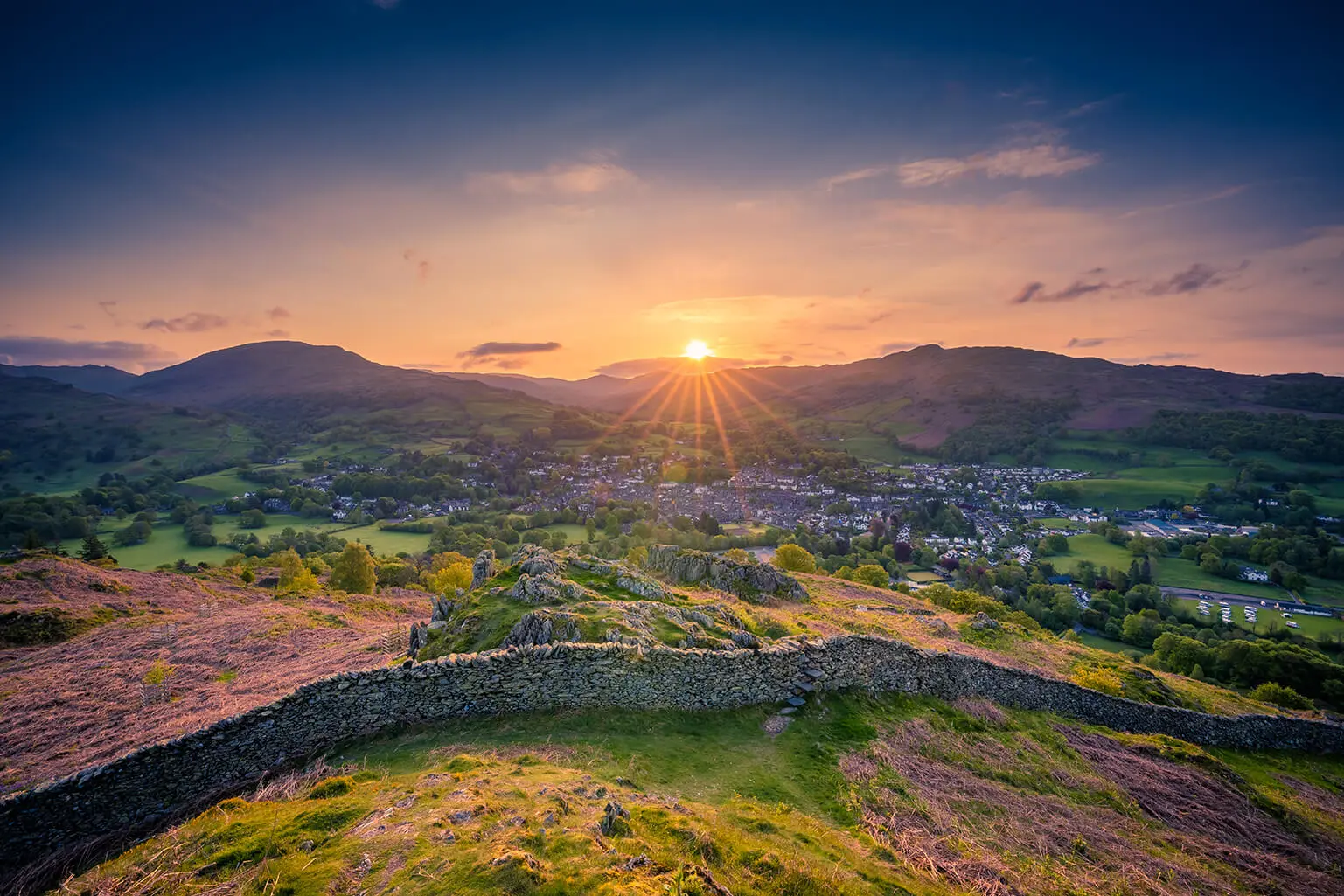 Lovely sunrise landscape over a Lake District town