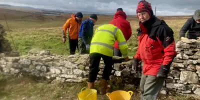 People dry stone walling