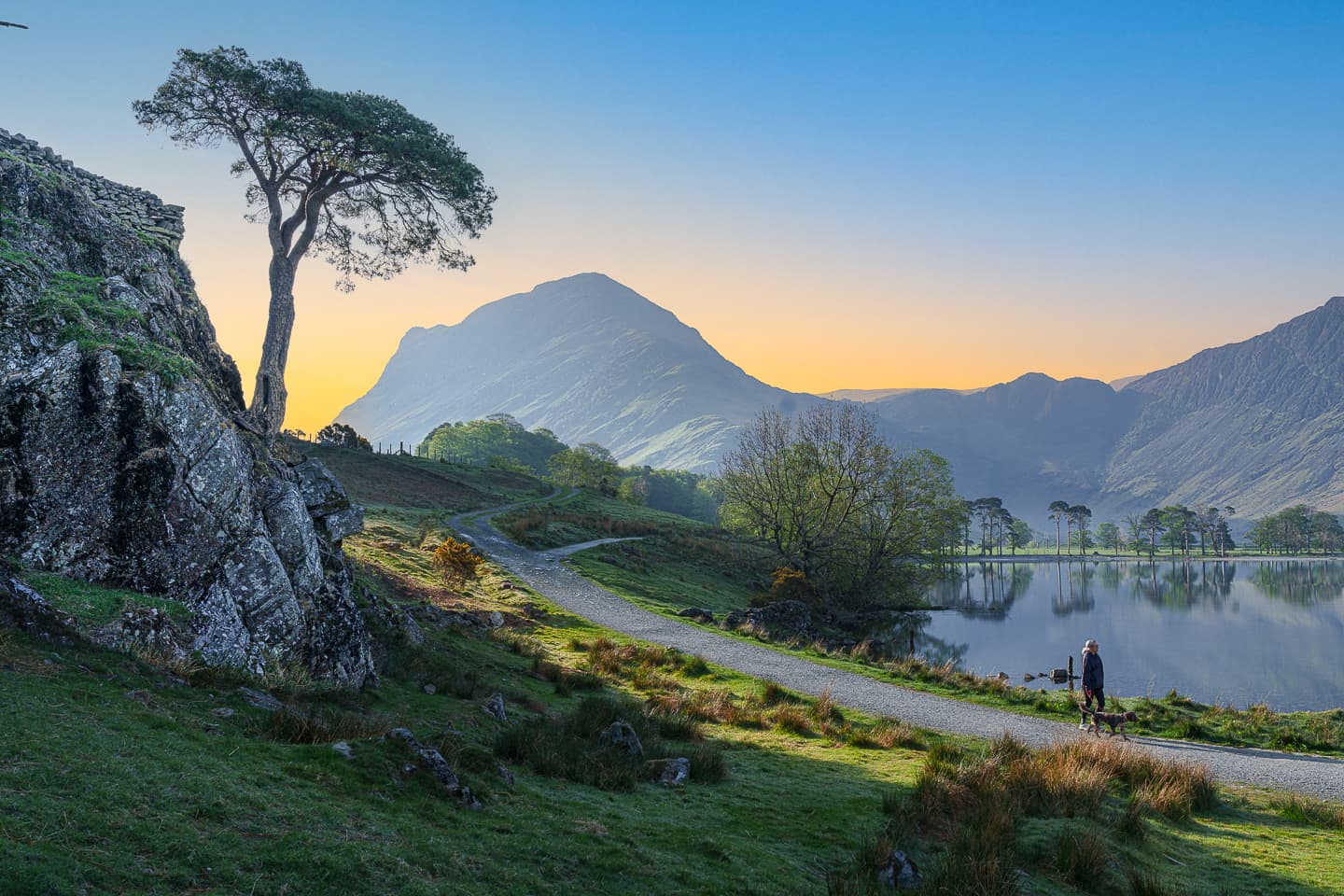 Someone walking a dog near beautiful Buttermere