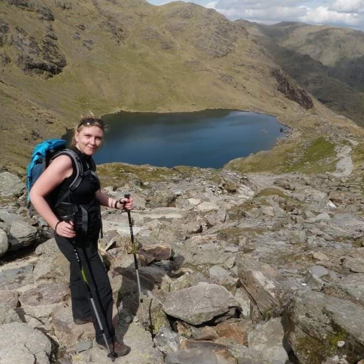 A woman called Claire standing above a lake
