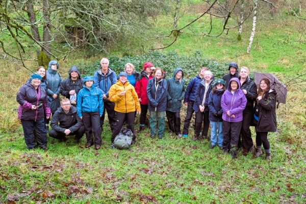 Friends of the Lake District staff team standing in a wood