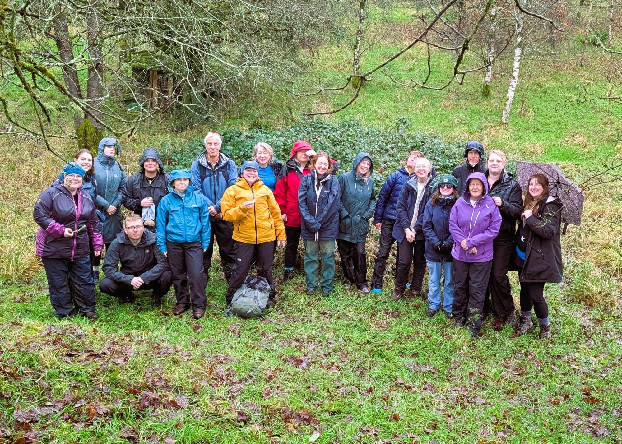 Friends of the Lake District staff team standing in a wood