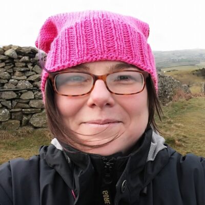 A woman in a pink hat and glasses