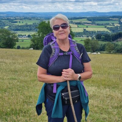 A woman walking in the hills