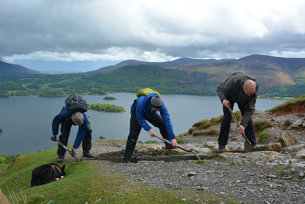 People repairing a footpath on a fell top