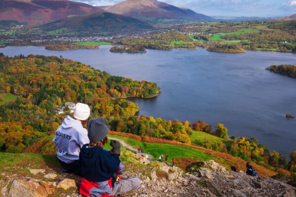 People looking across Derwentwater in the Lake District.
