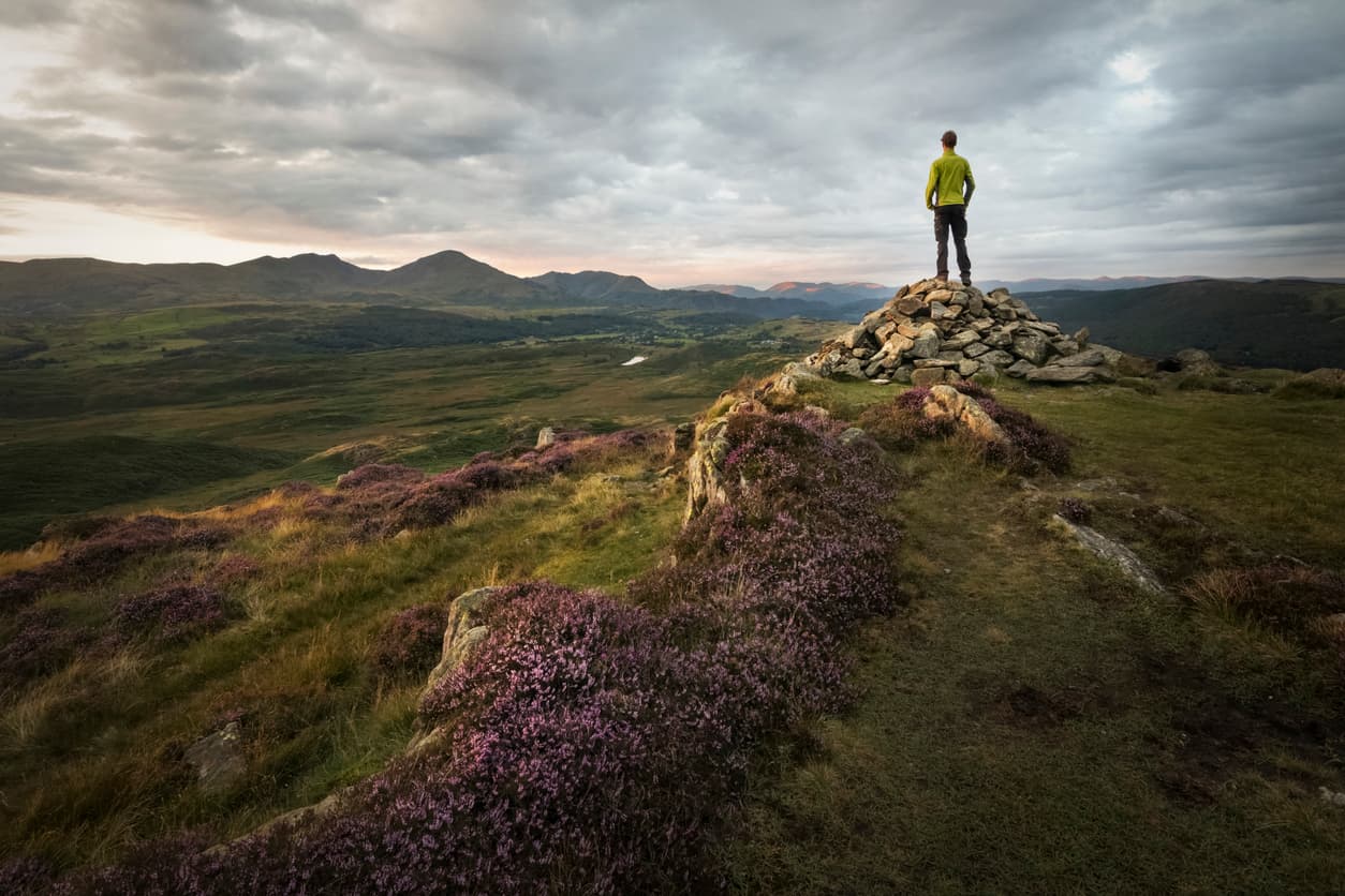 Man standing on a hill top