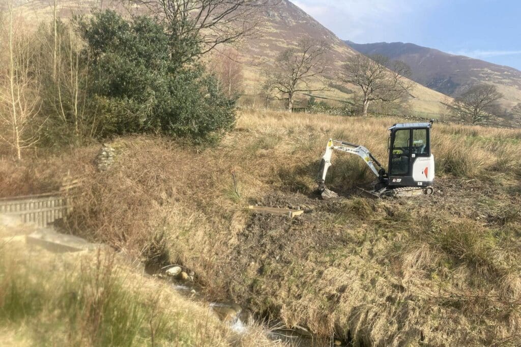 A digger at work on Dam Mire land