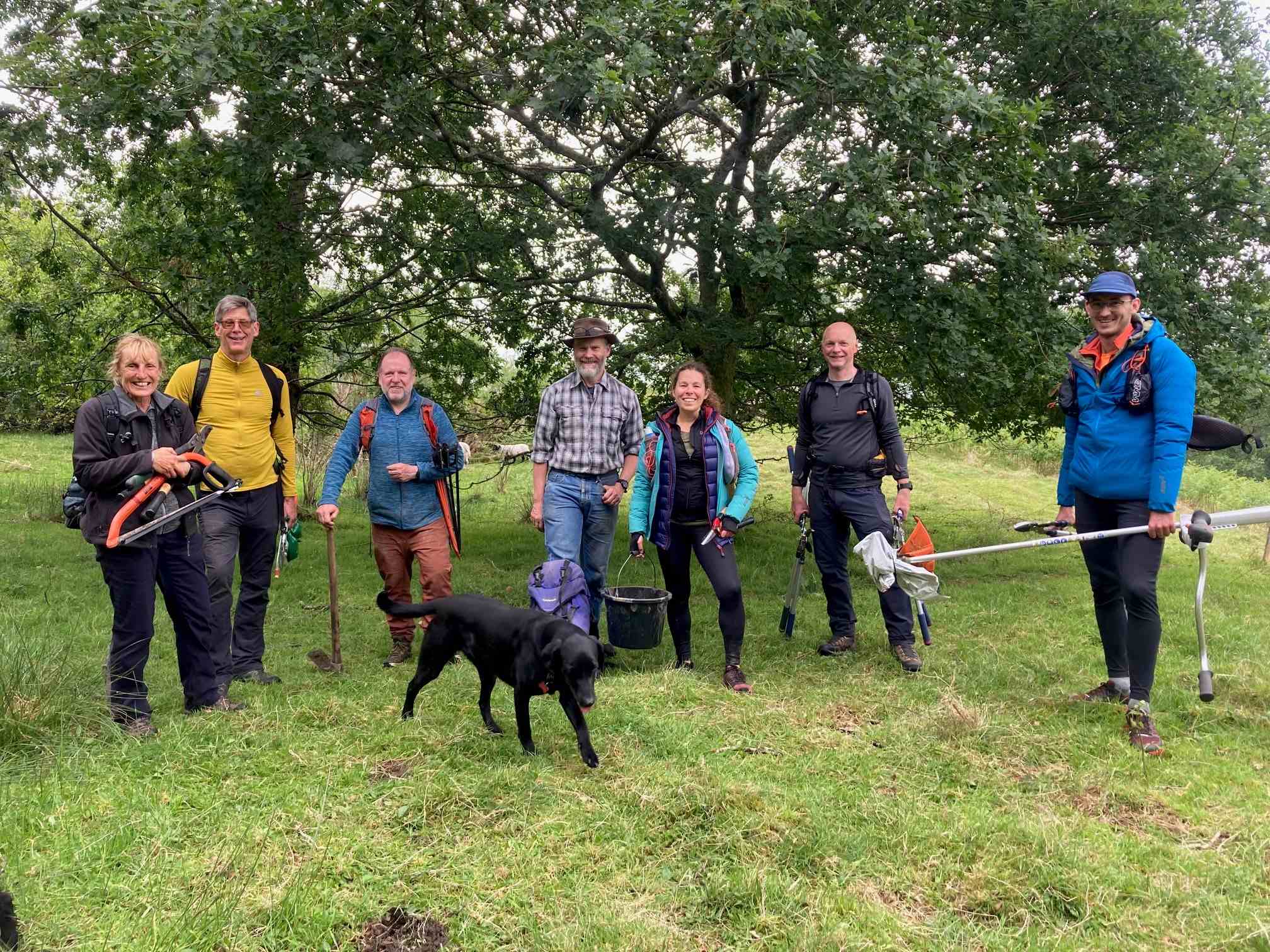 A smiling gang of volunteers at Sweden Wood